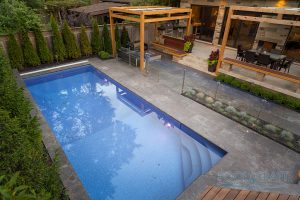 An incredible backyard pool and patio, designed to fit in this small space