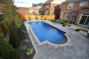 An amazing pool and patio built into a small backyard