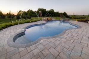 A deck jets water feature installed in a swimming pool