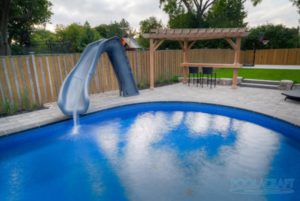 A water slide water features installed in a swimming pool