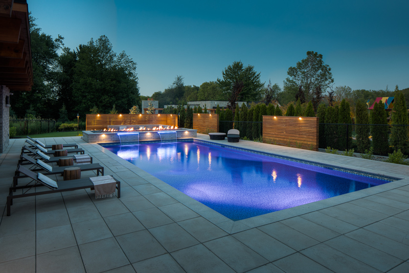 A night time image of a custom saltwater pool