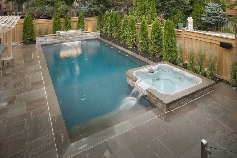 A custom shape backyard swimming pool