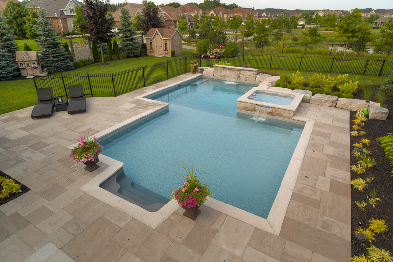 Custom shape swimming pool designed and installed by Pool Craft